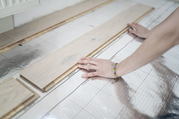 woman-laying-footstep-sound-insulation-partial-vi-2024-09-23-06-39-09-utc